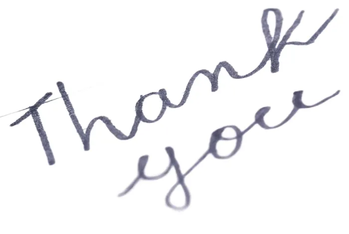 Handwritten Thank you note on a clean white background after AI background removal