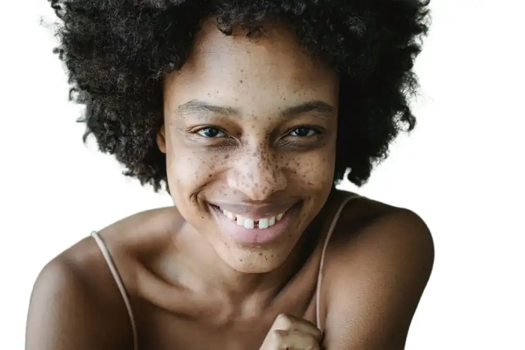 Background removal example: the same portrait with curly hair on a clean white background