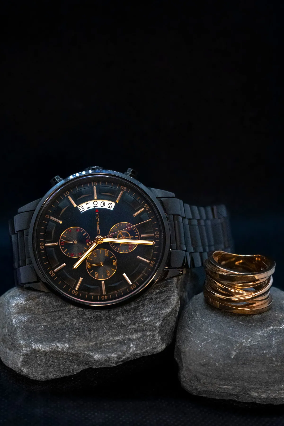Original luxury watch product photo on dark stones