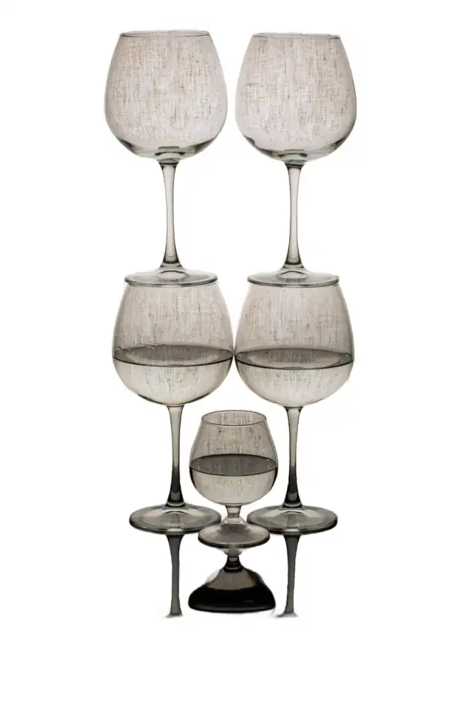 Stacked wine glasses on a clean white background after AI background removal